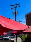 Red awning, phone wires